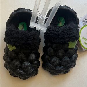 Black Fuzzy Bubble Crocs with Glow in Dark Stars. Perfect for Halloween